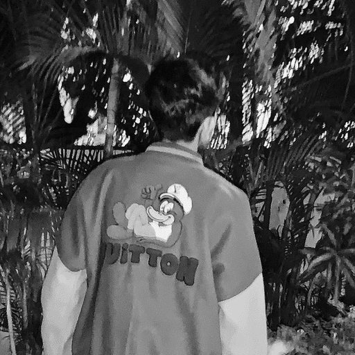 Utkarsh Thakur, photographed from behind in a varsity jacket